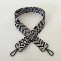 Close-up of black and white geometric patterned bag strap with gunmetal lobster clasps - No. 98 Gunmetal Buckle