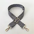 Close-up of number 98 black and white geometric wide bag strap with gold metal buckles - No. 98 Gold Buckle