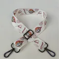Detail of adjustable off-white strap featuring colorful hot air balloon and windmill prints - No. 33 Gunmetal Buckle