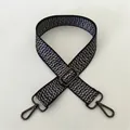 Detailed view of black and white woven strap with gunmetal swivel clasps and buckle - No. 99 Gunmetal Buckle