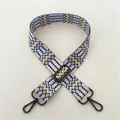 Detail view of ethnic blue and yellow geometric bag strap with gunmetal swivel hooks - Style 60 Gunmetal Buckle