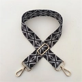 Detail of adjustable shoulder strap with black and white geometric pattern and gold hardware - Style 61 Gold Buckle