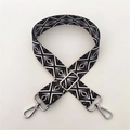 Detail view of adjustable geometric jacquard bag strap with silver metal lobster clasps - Style 61 Silver Buckle