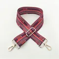 Close-up of bohemian red woven bag strap with blue geometric patterns and gold metal buckles - Style 04 Gold Hardware