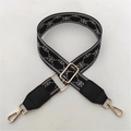 Detail of adjustable black and grey geometric strap with golden hooks and leather ends - Grey Black Pattern + Black Leather