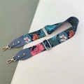 Detail showing adjustable wide floral shoulder strap with gold metal hooks and blue leather - Blue Flower With Lake Blue Leather End