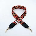 Detail of leopard print wide strap with gold-plated metal hooks and black leather ends - Orange