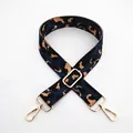 Close-up of leopard print canvas bag strap with golden metal lobster clasps - Blue
