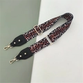 Detail of adjustable leopard print bag strap with golden metal hooks and leather ends - Leopard + Black Leather