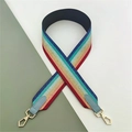 Close-up of colorful striped bag strap with glitter texture and gold metal hooks - Multicolor with Light Blue Leather
