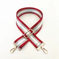 Close-up of adjustable striped wide bag strap with gold metal hooks and sliding buckle - Burgundy
