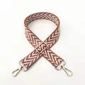Detailed close-up of brown herringbone woven strap with light gold metal hardware - Brown