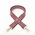 Detail of adjustable woven red and white zigzag bag strap with golden metal swivel hooks - Burgundy
