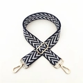 Detail of navy and white chevron woven strap with adjustable gold-tone metal hardware - Blue
