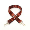 Detail of ethnic style woven strap with orange and black patterns and gold metal buckles - No. 18 Orange