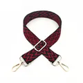 Detail of red and black geometric woven bag strap with golden rotating metal hooks - No. 24 Wine Red
