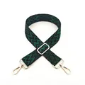 Close-up of adjustable woven strap with dark green geometric patterns and gold metal buckles - No. 25 Green