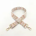 Detail of adjustable woven bag strap with brown and white geometric patterns and gold clips - Silver Clasp / No. 15 Light Khaki