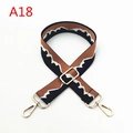 Macro detail of adjustable woven shoulder strap with wave pattern and gold metal hooks - A18 / Silver Clasp