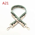 Detail of adjustable wide shoulder strap with wave jacquard pattern and gold lobster clasps - A21
