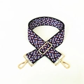 Close-up of red and blue zigzag jacquard bag strap with golden lobster metal clasps - Blue