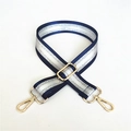 Detail of adjustable navy woven strap with silver glitter stripes and gold metal buckles - Blue
