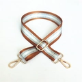 Detail of adjustable brown orange striped bag strap with gold metal hooks and glitter yarn - Brown