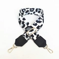Detail view of leopard print bag strap with gold metal buckles and black leather ends - Grayish White