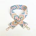 Macro detail of ethnic geometric embroidery on wide adjustable shoulder strap with gold hooks - Light Blue Pink Diamond (No. 39)