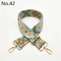 Close-up of ethnic geometric jacquard bag strap with polished gold metal hardware - Khaki Lake Blue Green Diamond (No. 42)