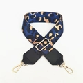 Detail view of leopard print wide strap with gold-tone hardware and adjustable buckle - Blue