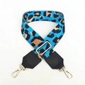 Close-up of leopard print woven bag strap with adjustable gold buckle and swivel hooks - Lake Blue