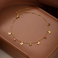 Detailed macro view of gold butterfly anklet with multi-colored gemstones on leather - Butterfly