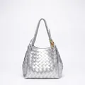 Silver woven shoulder bag with intricate Intrecciato texture and gold knot pendant charm - Large / Silver