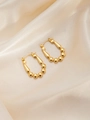 Macro detail of gold-tone U-shaped earrings with round beads on elegant silk fabric - U-shaped Gold Beads Style (BJGE0239)