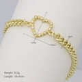 Macro detail of gold Cuban chain bracelet with 18x14mm zircon heart pendant - Hollow Pave Heart (DB241210-G)