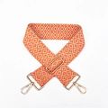 Detail of adjustable geometric strap with orange and grey ethnic weaving pattern - Orange