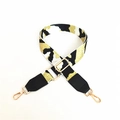 Detail of adjustable wide camouflage strap with leopard pattern and gold metal buckles - Khaki + Black Leather