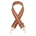 Close-up of brown adjustable bag strap with white arrow pattern and gold metal hardware - Brown