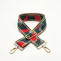 Macro view of thickened red and green camouflage shoulder strap with gold metal buckles - US 4