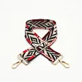 Detailed view of adjustable wide ethnic bag strap with geometric patterns and gold clips - No.4 Red