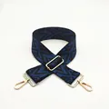 Macro shot of durable adjustable bag strap with blue geometric patterns and gold metal clips - Style 12 Blue