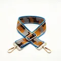 Detail of colorful camo bag strap with blue edges and golden metal swivel hooks - Size 19