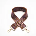 Close-up of ethnic paisley pattern bag strap with gold metal lobster clasps and buckle - No. 13 Brown