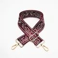 Close-up of ethnic style paisley pattern on burgundy adjustable shoulder strap with gold hooks - No.14 Wine Red