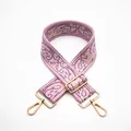 Close-up of pink paisley embroidered bag strap with golden rotating metal hooks - No. 15 Pink