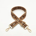Close-up of ethnic style woven bag strap with golden metal lobster clasps and adjustment buckle - Brown Floral (Silver Buckle)