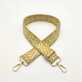 Close-up of adjustable woven shoulder strap with yellow geometric patterns and gold metal clips - Yellow (Silver Buckle)