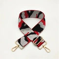Close-up of adjustable camo shoulder strap with red and black nylon and gold hardware - Camouflage Red Silver Thread
