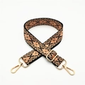Close-up of ethnic geometric woven strap with gold metal rotating hooks and buckle - Black Pink Floral (Silver Buckle)